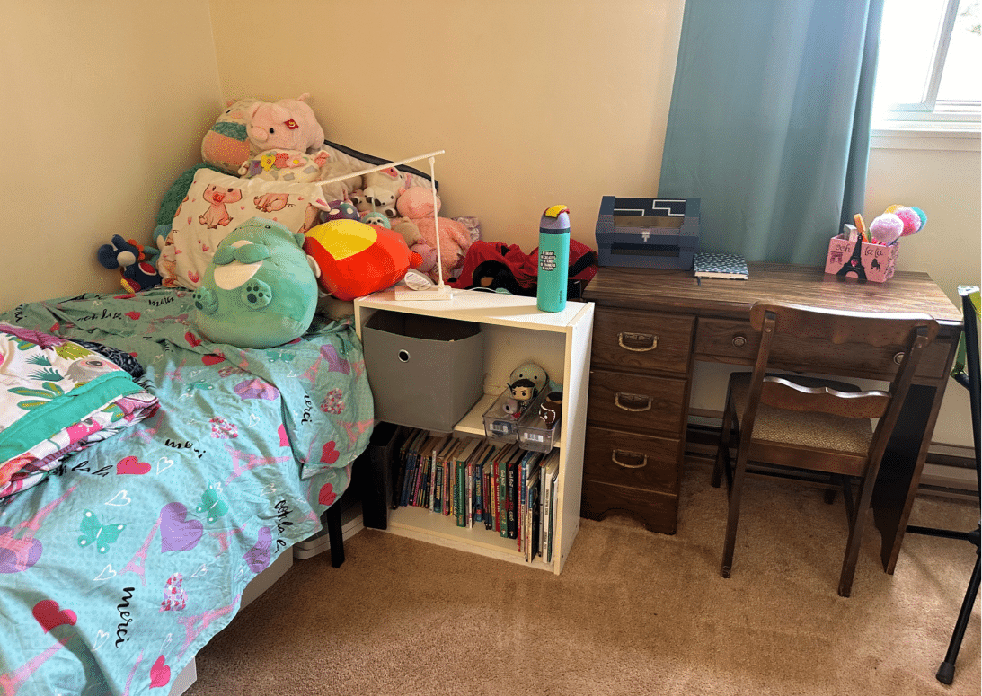 Child's organized bedroom in Binghamton, NY after organizing services by Decluttering Chaos, with easy access to her desk and belongings